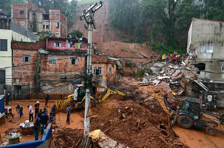 Rescue teams remove debris after a landslide caused by heavy rains in Juiz de Fora, Brazil.—AFP