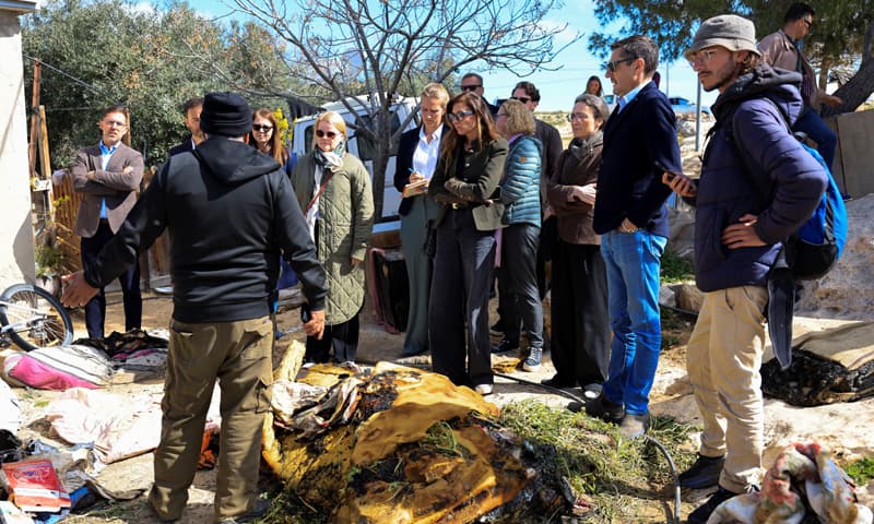 HEBRON: Members of a European Union delegation visit a site in the occupied West Bank which was damaged by Israeli settlers,.&mdash;Reuters