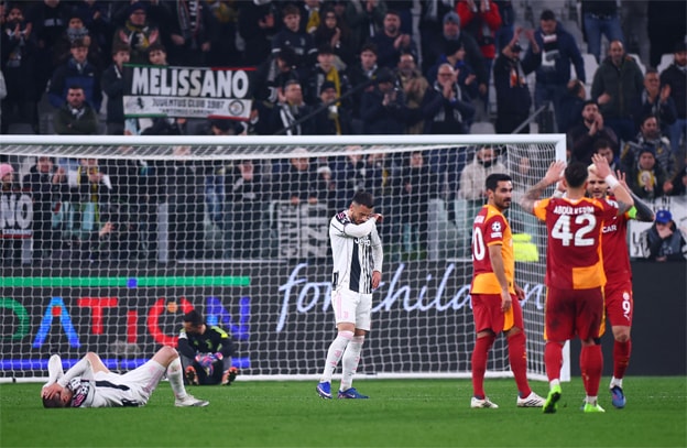 TURIN: Juventus’ Edon Zhegrova (L) and Filip Kostic look dejected after the match as Galatasaray players celebrate at the Allianz Stadium.—Reuters