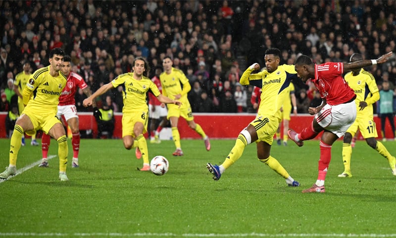 NOTTINGHAM: Callum Hudson-Odoi (R) of Nottingham Forest shoots to score against Fenerbahce during their Europa League knockout round play-off second leg at The City Ground.&mdash;AFP