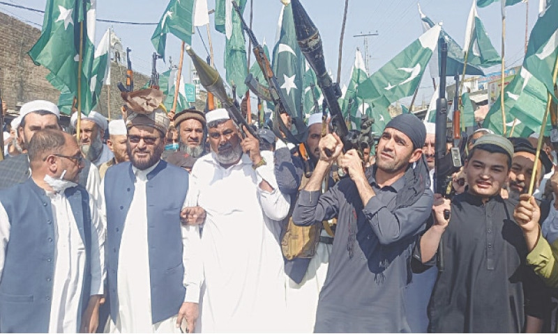 Locals display arms at a rally organised in support of armed forces in Mohmand tribal district on Saturday. &mdash; Dawn