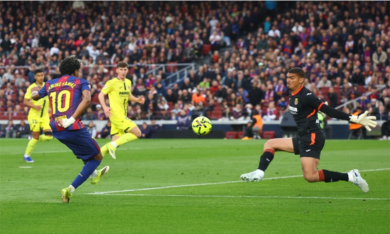 BARCELONA&rsquo;S Lamine Yamal scores past Villarreal goalkeeper Luiz Junior during their La Liga match at Camp Nou on Saturday.&mdash;Reuters
