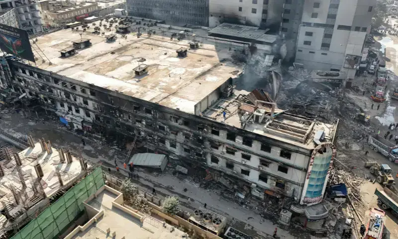 An aerial view shows the charred remains of a shopping mall after a massive fire in Karachi on January 21, 2026. &mdash; AFP/File