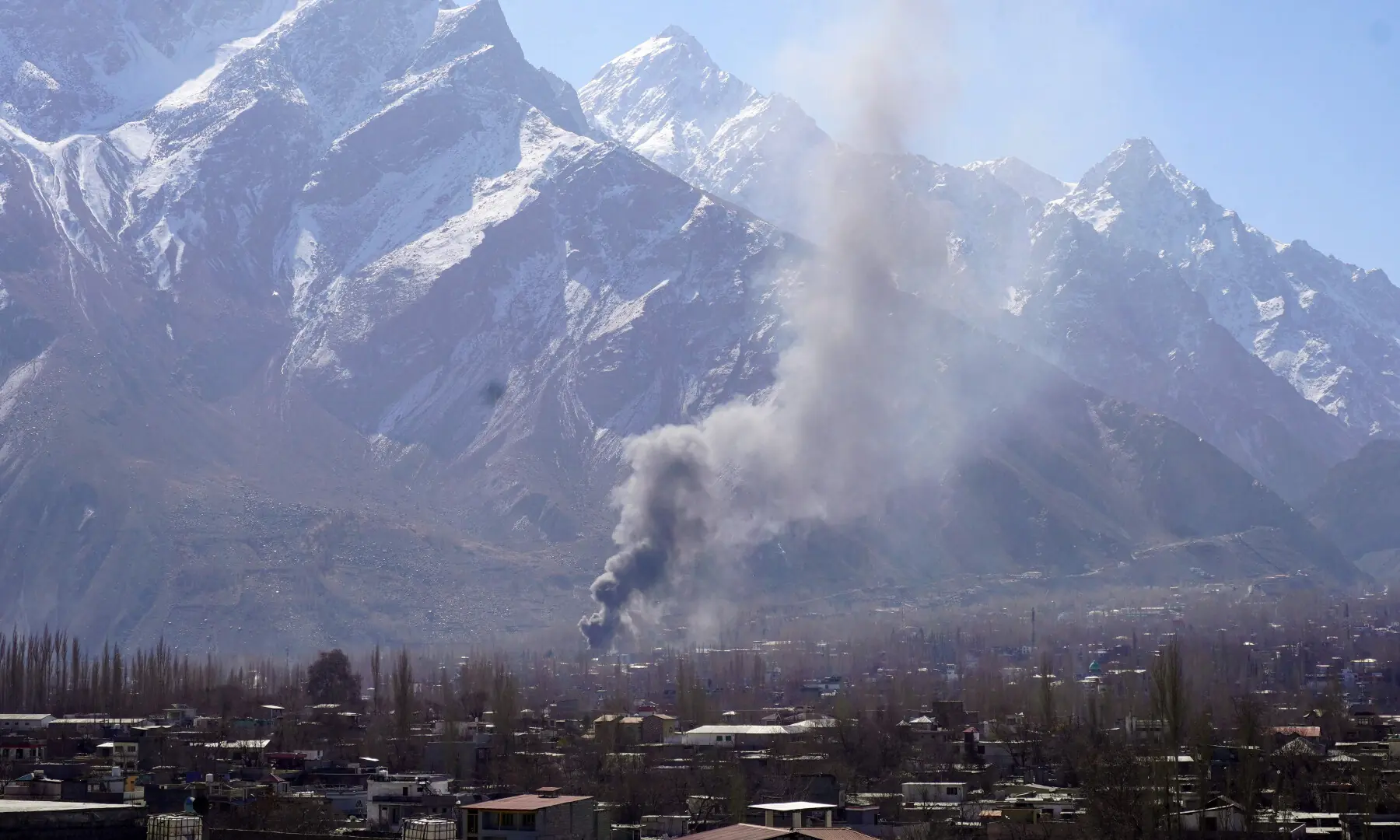Smoke billows after protesters set fire to a United Nations office during an anti-US and Israel protest in Skardu in Gilgit-Baltistan on March 1, 2026. — AFP