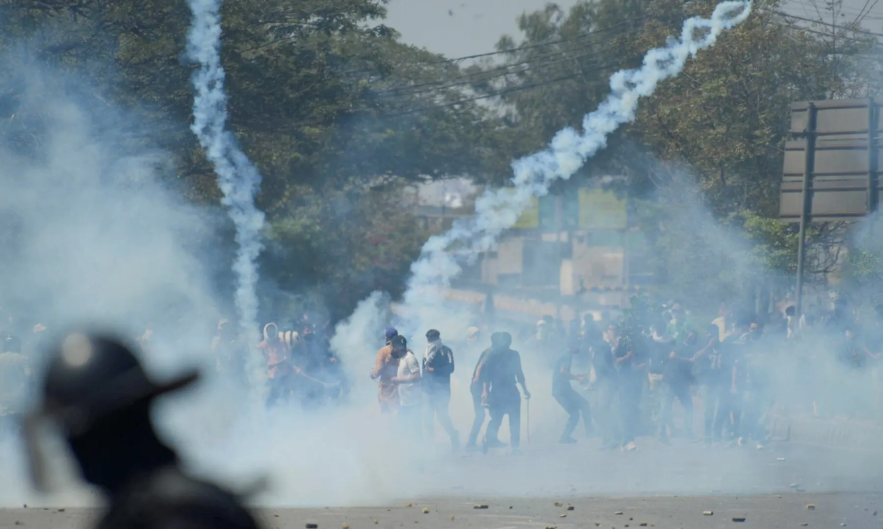 Security forces fire teargas to disperse protesters, outside the US Consulate General in Karachi on March 1, 2026. &mdash; Reuters