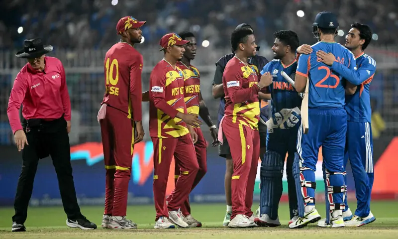 Umpire Alex Wharf gestures as West Indies&rsquo; Roston Chase, Gudakesh Motie, Shamar Joseph and Shimron Hetmyer congratulate India&rsquo;s Sanju Samson, Shivam Dube and Abhishek Sharma for their team&rsquo;s win at the end of their 2026 ICC Men&rsquo;s T20 Cricket World Cup Super Eights match in the Eden Gardens, Kolkata on March 1, 2026. &mdash; AFP
