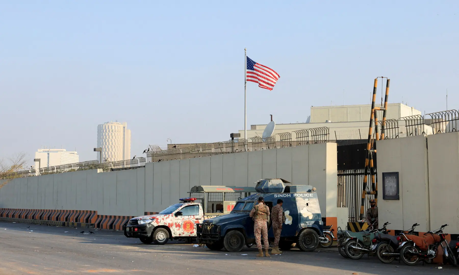 Police and Ranger vehicles stand outside the US Consulate General, a day after a protest, in Karachi on March 2, 2026. &mdash; Reuters