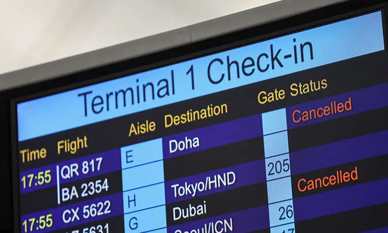 A screen displays cancelled flights to Middle Eastern destinations at Hong Kong International Airport in Hong Kong on March 2. &mdash; Reuters