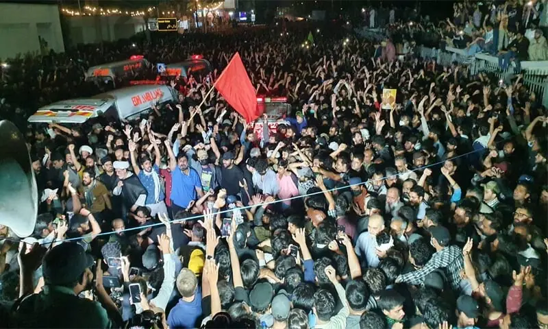 Protesters converge at the Numaish intersection for funeral prayers as ambulances bring the bodies of the victims shot dead near the US consulate.&mdash;Dawn/File