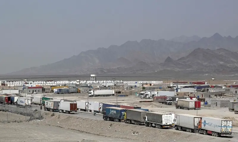 Cargo trucks wait to enter the Pakistan-Iran border crossing at Taftan, Balochistan province on March 2, 2026 amid ongoing US-Israel strikes on Iran. &mdash;AFP/File