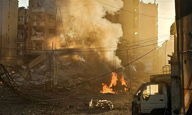 Fires erupt from buildings damaged in an early morning Israeli strike on Beirut&rsquo;s southern suburbs on March 3, 2026. &mdash;AFP