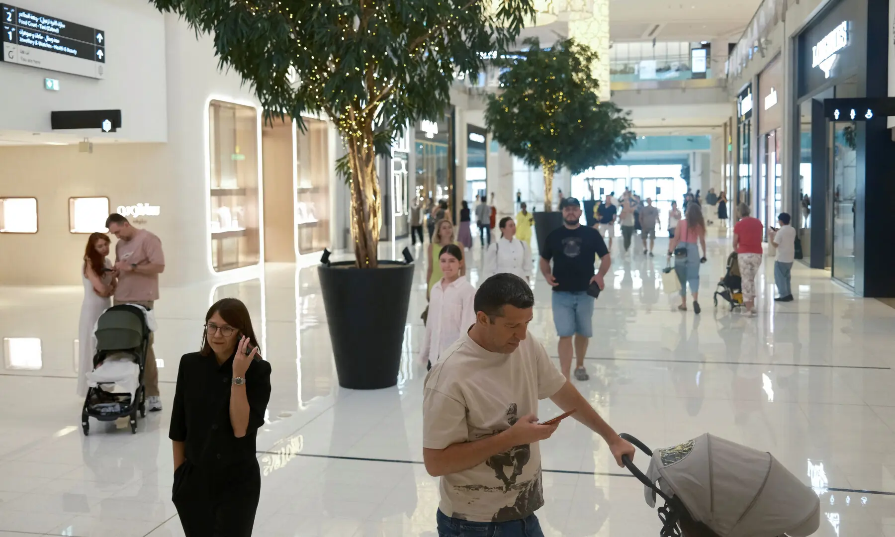 People walk at Dubai Mall amid the U.S.-Israel conflict with Iran, in Dubai, United Arab Emirates on March 3, 2026. — Reuters