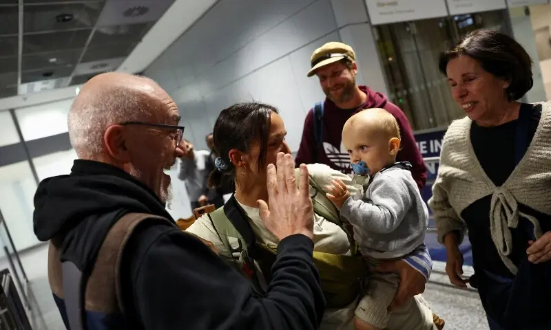 Passengers reunite with family following their evacuation from Dubai at Frankfurt Airport in Germany on March 3, amid the Iran-Israel-US conflict. &mdash; Reuters