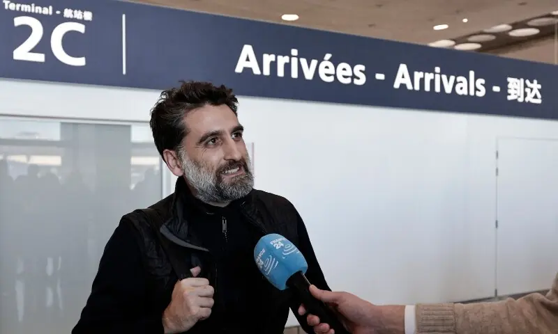 A passenger speaks to the press after disembarking from a flight coming from Dubai at Roissy-Charles de Gaulle Airport on the outskirts of Paris, France on March 3. &mdash; AFP