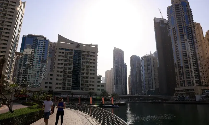 People walk in Dubai Marina, amid the U.S.-Israeli conflict with Iran, in Dubai, United Arab Emirates, March 3, 2026. &mdash;Reuters/File