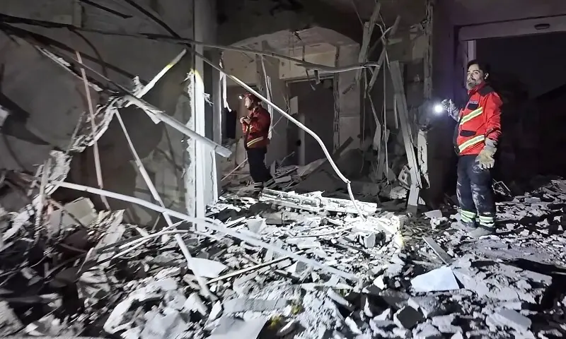This frame grab from AFPTV video footage taken on March 4, 2026 shows first responders inspecting the damage at Comfort Hotel after it was hit by an Israeli strike in Beirut&rsquo;s eastern suburb of Hazmieh. &mdash;AFP