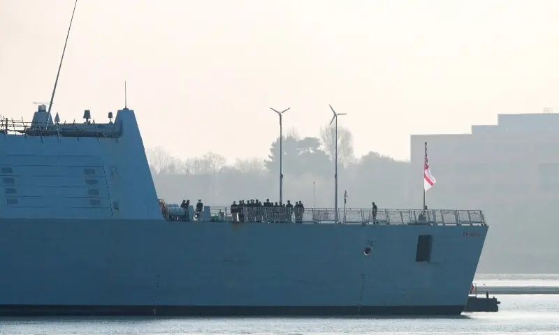 Crew members stand aboard the HMS Dragon during ammunitioning operations at Upper Harbour Ammunitioning Facility (UHAF) in Portsmouth Harbour,in Portsmouth, Britain, March 4, 2026. &mdash;Reuters