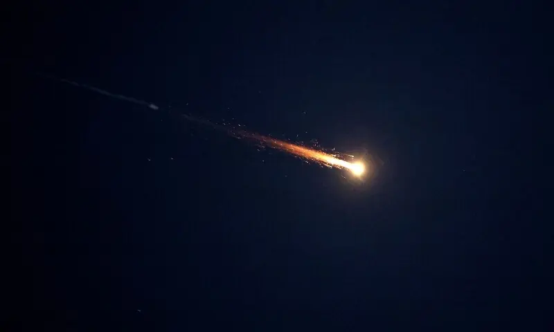 Rocket trails are seen in the sky above Netanya amid a fresh barrage of Iranian missile attacks on March 3, 2026. &mdash;AFP/File