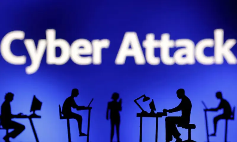 Figurines with computers and smartphones are seen in front of the words &ldquo;Cyber Attack&rdquo; in this illustration taken on February 19, 2024. &mdash; Reuters