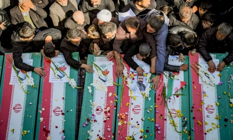 Mourners in the city of Qom attend the funeral of those killed in the US-Israeli war with Iran on March 5. &mdash; AFP