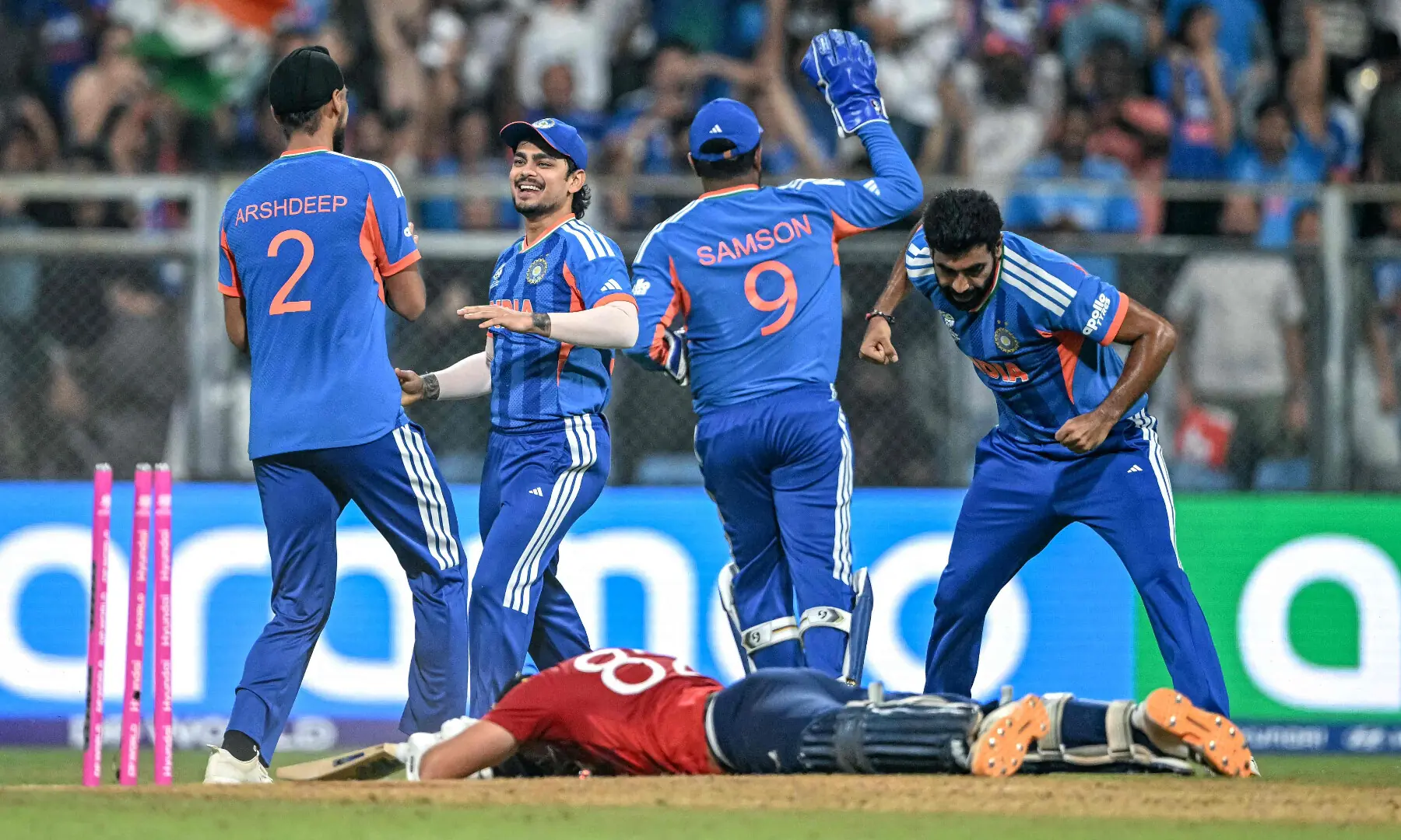 India&rsquo;s players celebrate after the dismissal of England&rsquo;s Jacob Bethell (bottom) during the 2026 ICC Men&rsquo;s T20 Cricket World Cup semi-final match between India and England at the Wankhede Stadium in Mumbai on March 5, 2026. &mdash; AFP