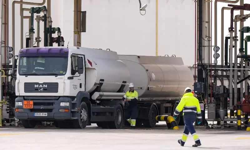 Workers load fuel tankers onto transport trucks at a fuel distribution center near Burgos, northern Spain, on March 5, 2026. &mdash;AFP/File