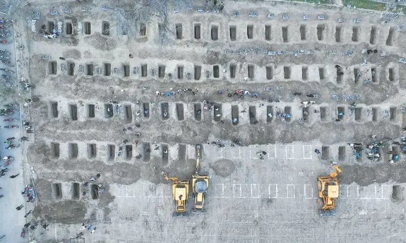 This aerial handout picture, released by the Iranian Press Centre on Tuesday, shows mourners digging graves for children killed in a US-Israeli strike on a primary school in Minab city of Iran&rsquo;s Hormozgan province.&mdash;AFP