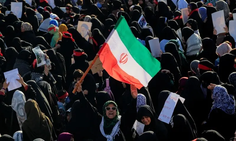 A woman chants slogans and holds an Iranian flag during a demonstration protesting the assassination of Iran&rsquo;s supreme leader Ayatollah Ali Khamenei in US and Israeli strikes, in Karachi, on March 6. &mdash; Reuters