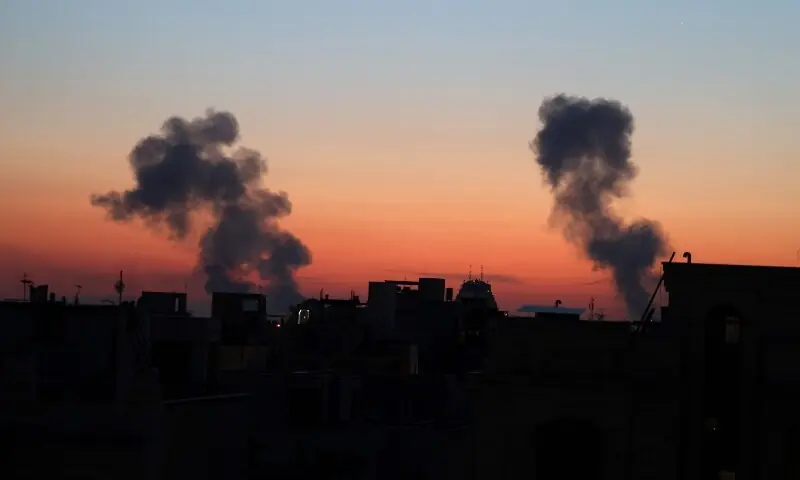 Black plumes of smoke ascend from the site of an airstrike in a central area of Tehran, Iran on March 6. &mdash; AFP
