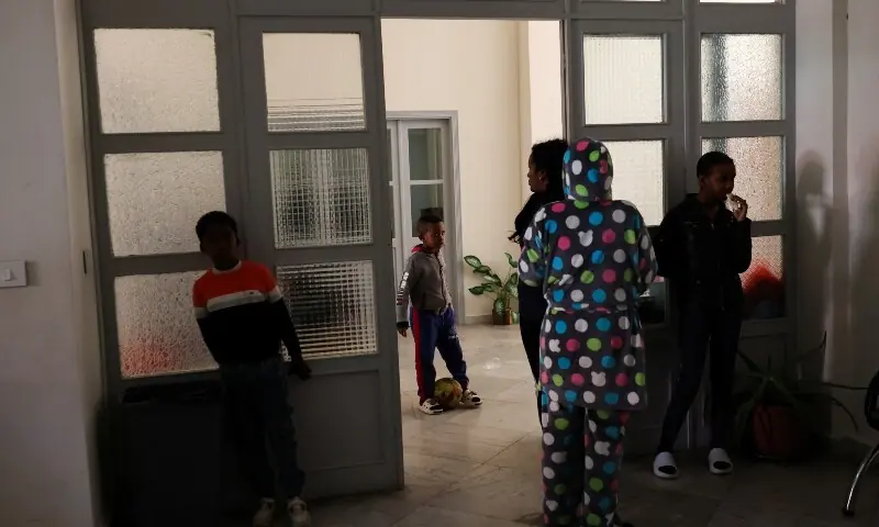 A boy plays with a football, as refugees and displaced migrant workers shelter in St. Joseph Church, following an escalation between Hezbollah and Israel amid the US-Israeli conflict with Iran, in Beirut, Lebanon, March 6, 2026.