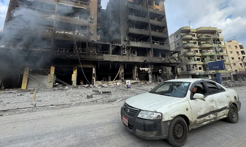 A car drives past burned buildings after an Israeli strike on Beirut&rsquo;s southern suburbs, following an escalation between Hezbollah and Israel amid the US-Israeli conflict with Iran, Lebanon on March 7, 2026. &mdash; Reuters