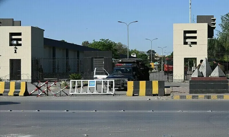 Policemen stand guard at the main entrance of the army&rsquo;s General Headquarters (GHQ) in Rawalpindi on May 10, 2023. &mdash; Reuters/File
