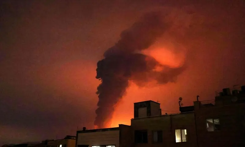 Explosions erupt following strikes at Shahran Oil Refinery in Tehran on March 7. &mdash; AFP