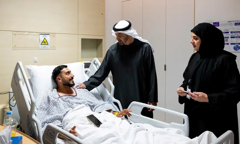 UAE President Sheikh Mohamed bin Zayed Al Nahyan meets an injured patient receiving treatment at a hospital in Abu Dhabi on March 6, 2026. &mdash; UAE Presidential Court via Reuters