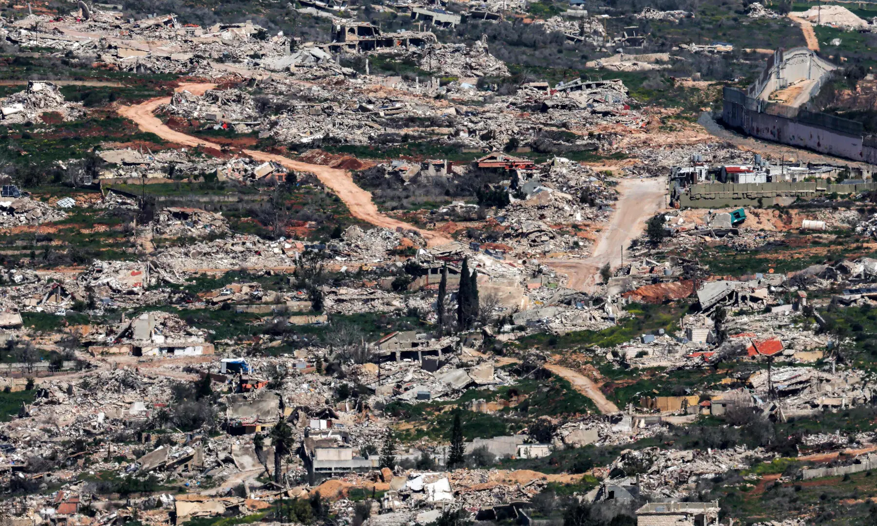 Destroyed buildings are pictured in the southern Lebanese town of Kfar Kila as seen from across the border in northern Israel on March 8, 2026. &mdash; AFP