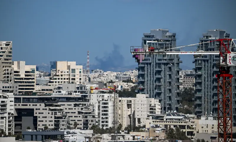 Smoke rises following an Iranian projectile strike, in Tel Aviv, Israel on March 8, 2026. &mdash; Reuters