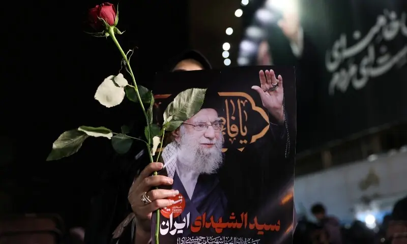 A woman holds a picture of Iran&rsquo;s late Supreme Leader Ayatollah Ali Khamenei, after his son Mojtaba Khamenei was introduced as Iran&rsquo;s new supreme leader, amid the US-Israeli conflict with Iran, in Tehran, Iran, March 9, 2026. &mdash;Reuters