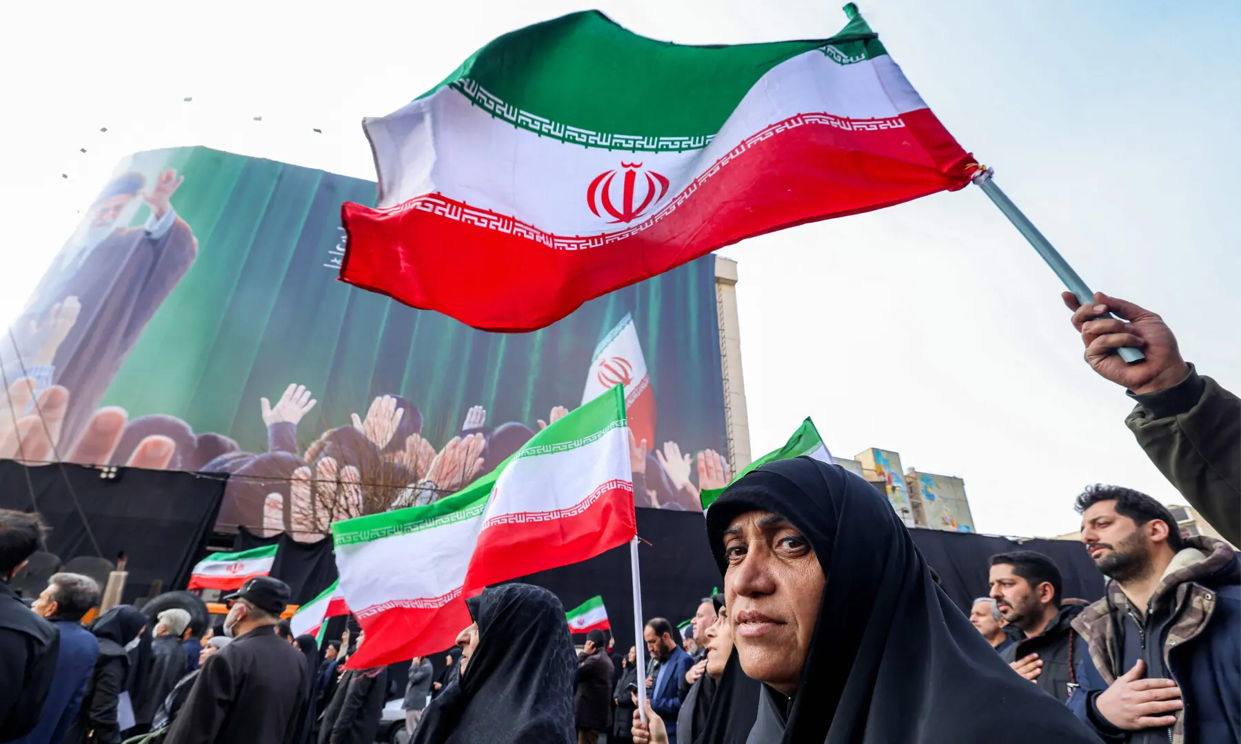 Demonstrators gather with Iranian national flags for a rally in support of the new Supreme Leader at Enghelab Square in central Tehran on March 9, 2026. &mdash; AFP