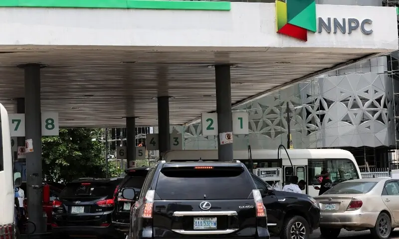Motorists queue for fuel on the forecourt of a Nigerian National Petroleum Company (NNPC) filling station as fuel costs rise amid the US-Israeli conflict with Iran, in Lagos, Nigeria on March 9. &mdash; Reuters