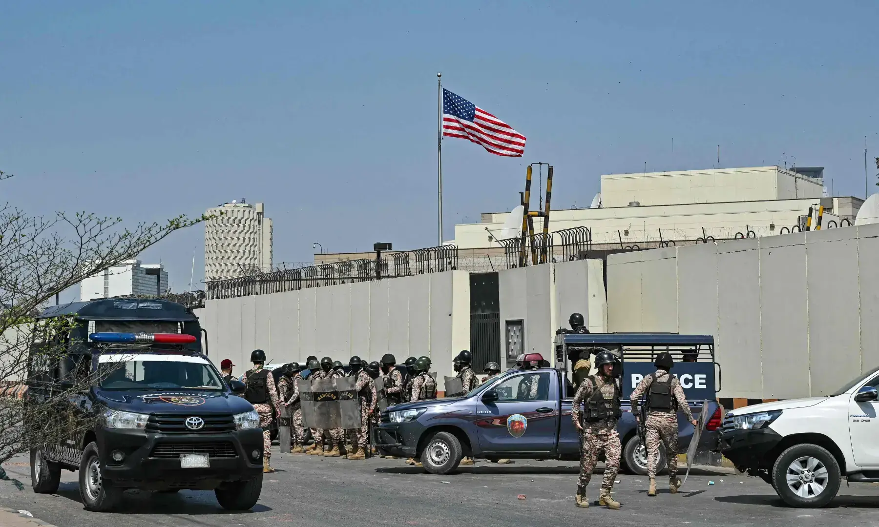 Security personnel stand guard outside the US consulate in Karachi on March 1, 2026. &mdash; AFP