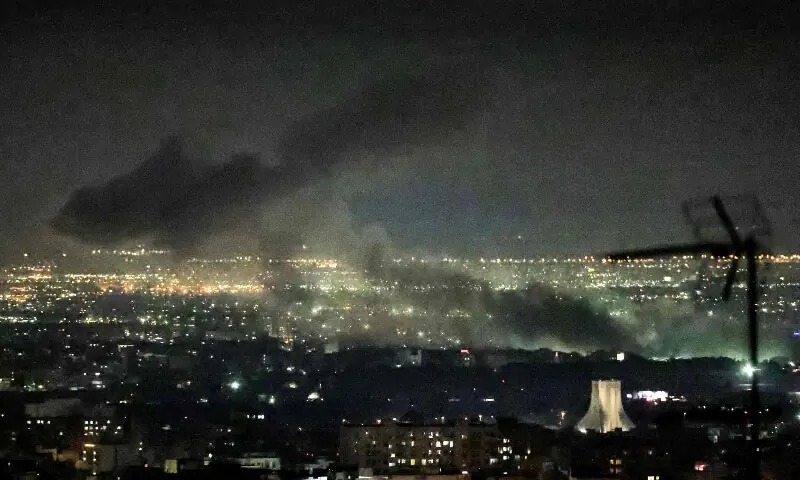 Smoke plumes billow from the site of airstrikes near Azadi Tower in western Tehran on March 10, 2026. &mdash;AFP