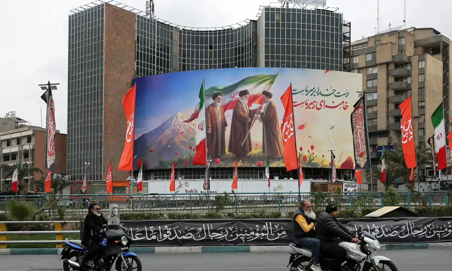 A banner of Iran&rsquo;s new supreme leader Mojtaba Khamenei with late supreme leader Ayatollah Ali Khamenei and late supreme leader Ayatollah Ruhollah Khomeini on a building, amid the US-Israeli conflict with Iran, in Tehran, Iran on March 10. &mdash; WANA via Reuters