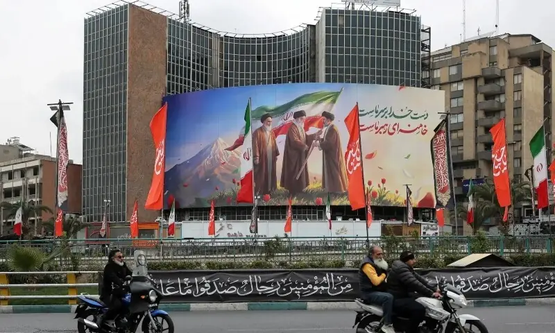 A banner of Iran&rsquo;s new supreme leader Mojtaba Khamenei with late supreme leader Ayatollah Ali Khamenei and late supreme leader Ayatollah Ruhollah Khomeini on a building, amid the US-Israeli conflict with Iran, in Tehran, Iran on March 10, 2026. &mdash; Reuters