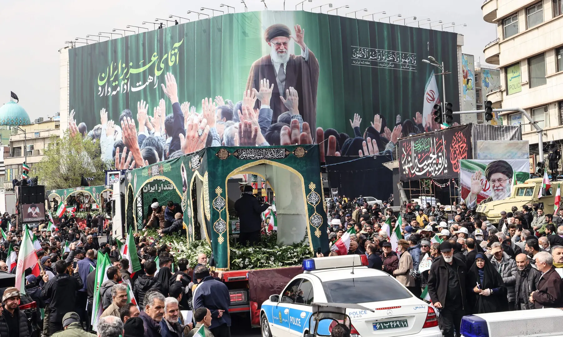 Iranians gather beside a billboard depicting Iran&rsquo;s slain supreme leader Ayatollah Ali Khamenei as they attend the funeral of Iran&rsquo;s Revolutionary Guards Corps (IRGC) commanders, army commanders and others killed in the early days of the United States and Israeli strikes on Iran, at Enghelab Square in Tehran on March 11, 2026. &mdash; AFP