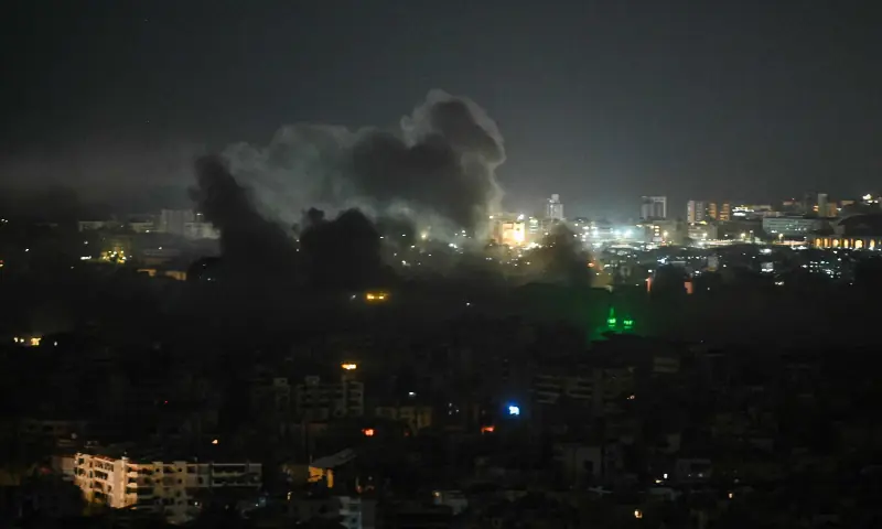 A plume of smoke rises from the site of an Israeli airstrike in the southern suburbs of Beirut early on March 12, 2026. &mdash; AFP