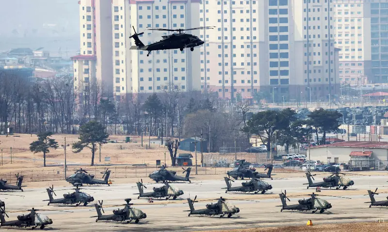 This picture taken on March 9, 2026 shows a US Army UH-60 Black Hawk helicopter flying over a US military base in Pyeongtaek. &mdash; AFP