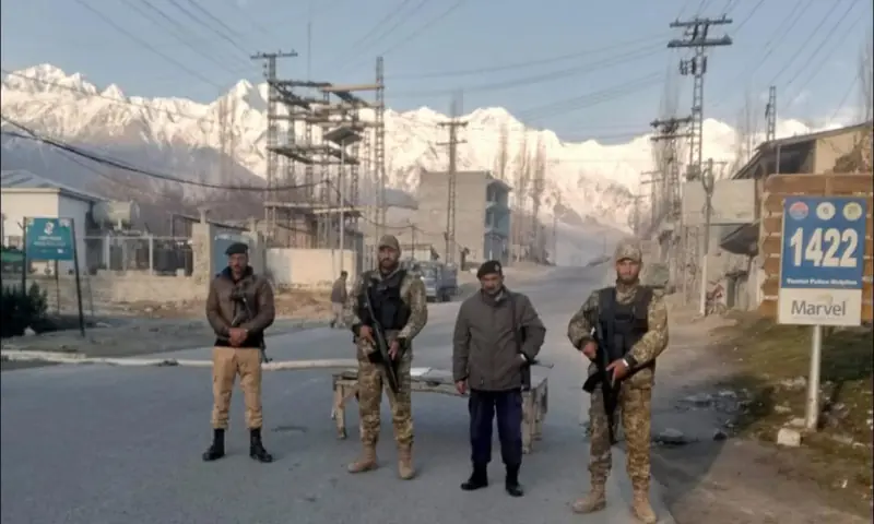Security personnel stand guard on a road in Skardu on March 11, 2026. &mdash; via author