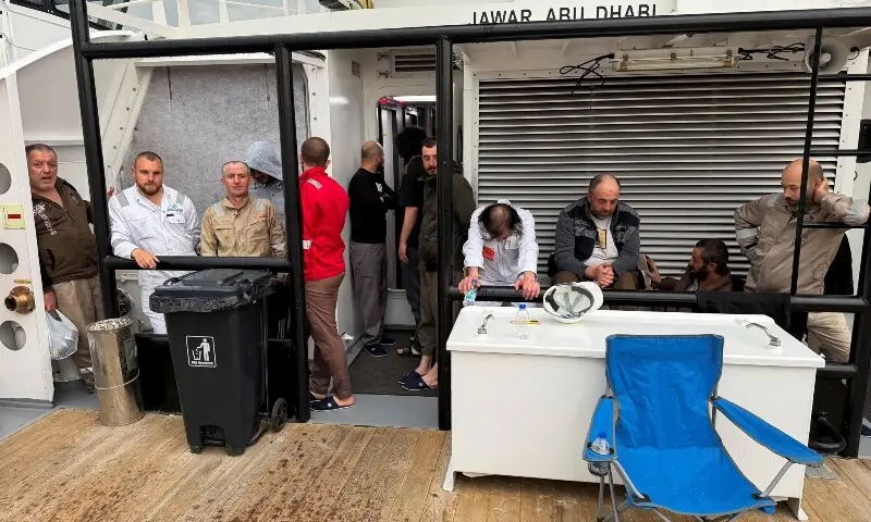 Crew members rescued from the fuel tanker Zephyros stand aboard an Iraqi vessel, after the tanker was set ablaze in an apparent attack in Iraqi waters, according to port and maritime security sources, amid the US-Israeli conflict wih Iran, at the port of Faw, Basra province, Iraq, March 12, 2026. &mdash;Reuters