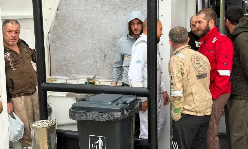 Crew members rescued from the fuel tanker Zephyros stand aboard an Iraqi vessel, after the tanker was set ablaze in an apparent attack in Iraqi waters, according to port and maritime security sources, amid the US-Israeli conflict wih Iran, at the port of Faw, Basra province, Iraq, March 12, 2026. &mdash;Reuter