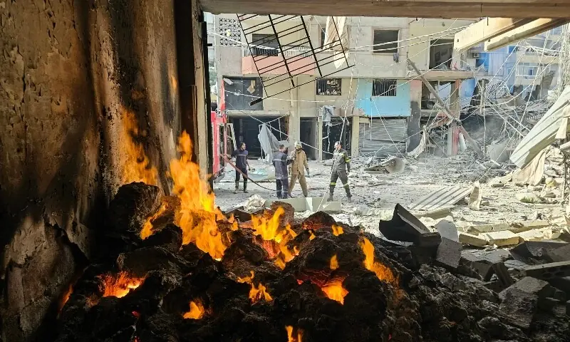 Firefighters work at the site of overnight Israeli airstrikes in the Haret Hreik neighbourhood of Beirut&rsquo;s southern suburbs on March 12, 2026. &mdash;Reuters